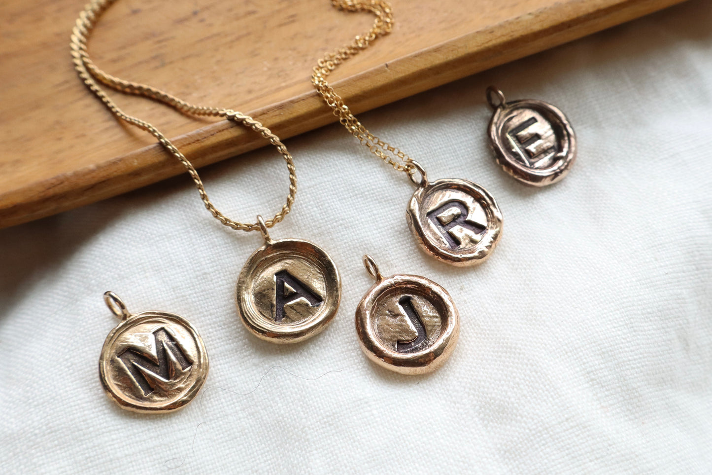 initial pendant in bronze
