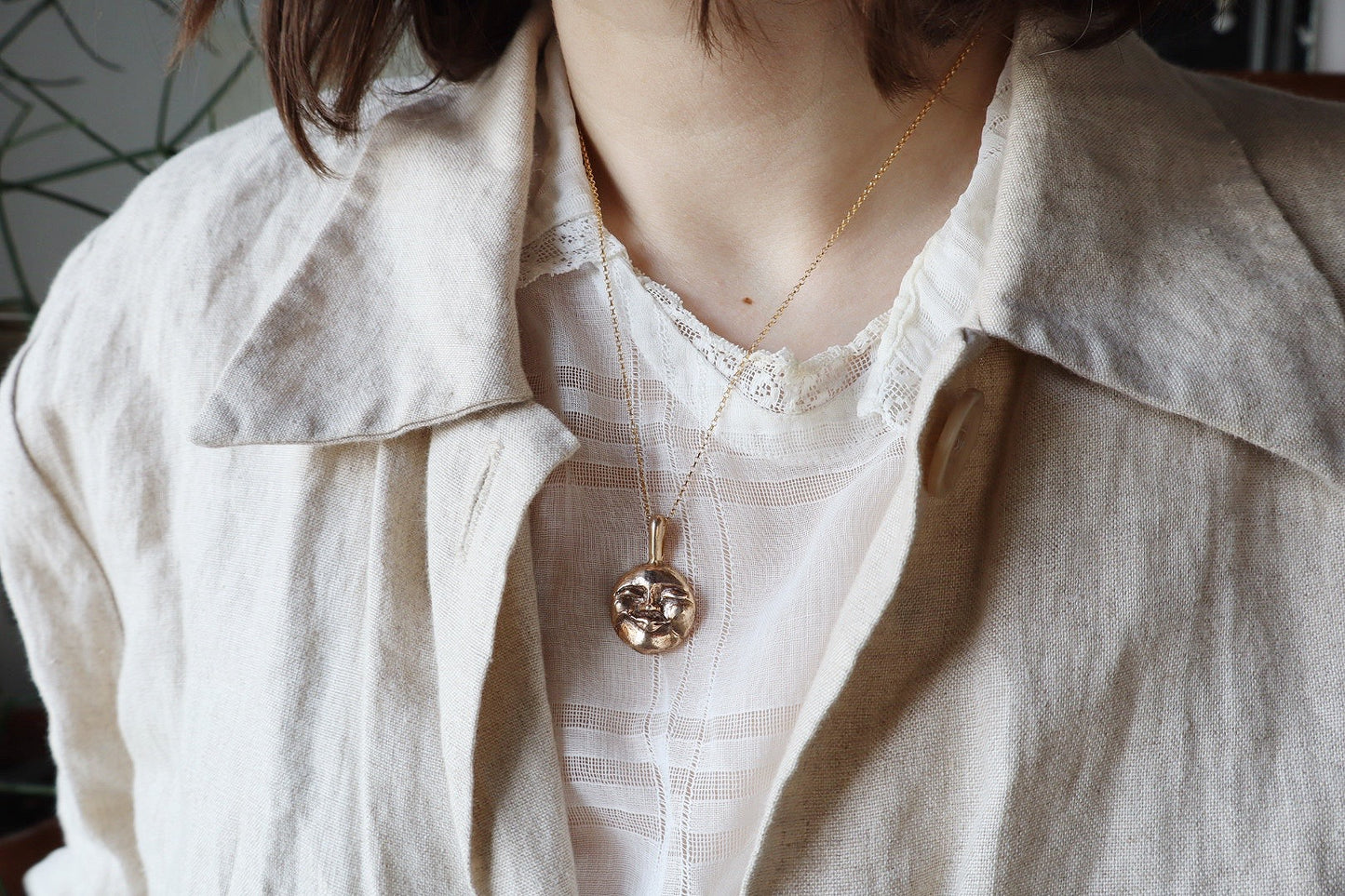 Moon face talisman necklace