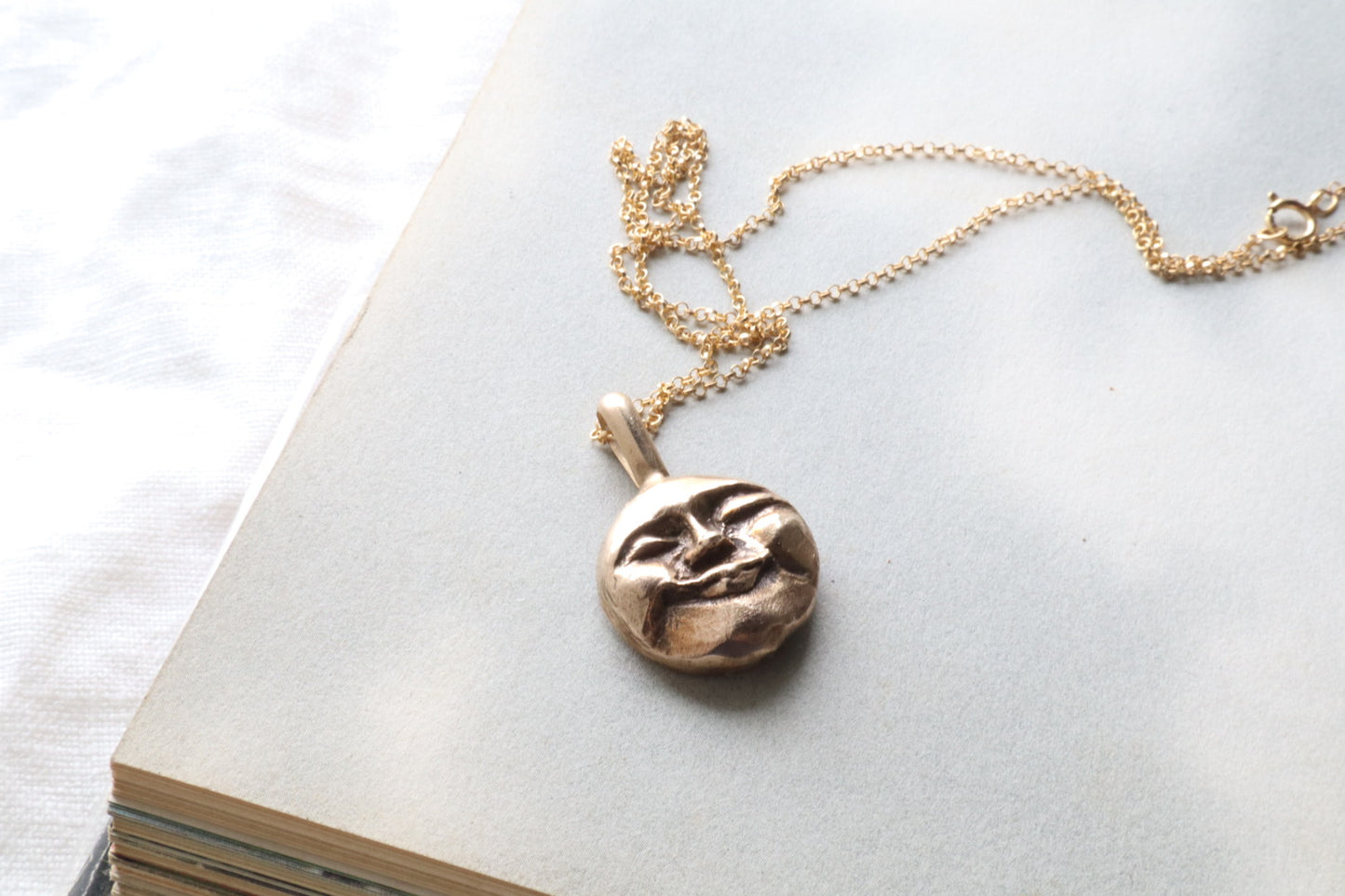 Moon face talisman necklace