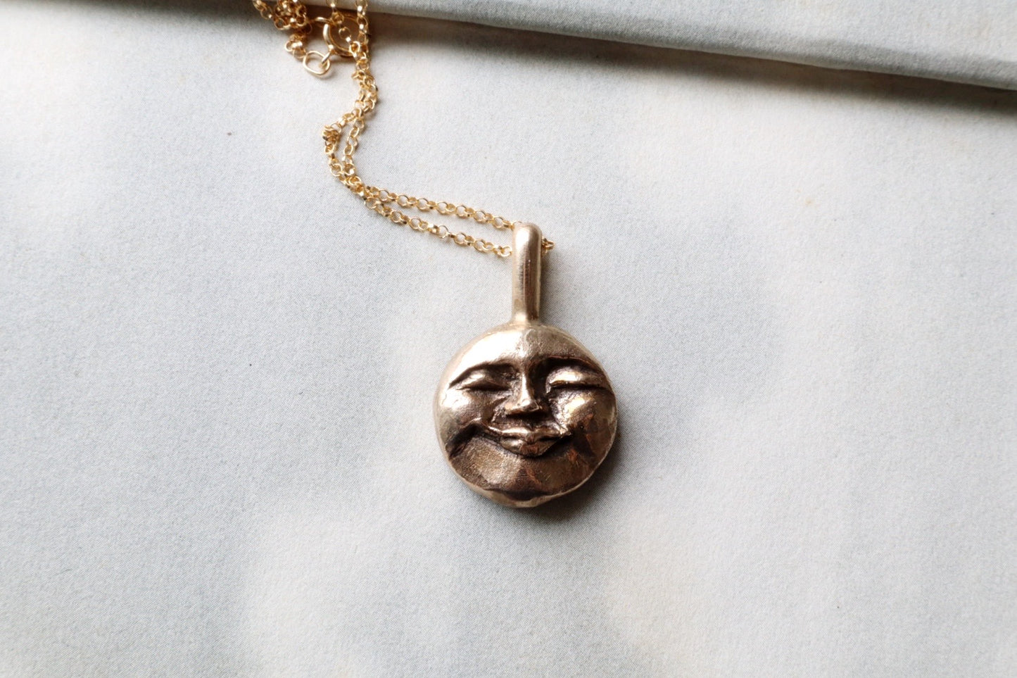 Moon face talisman necklace