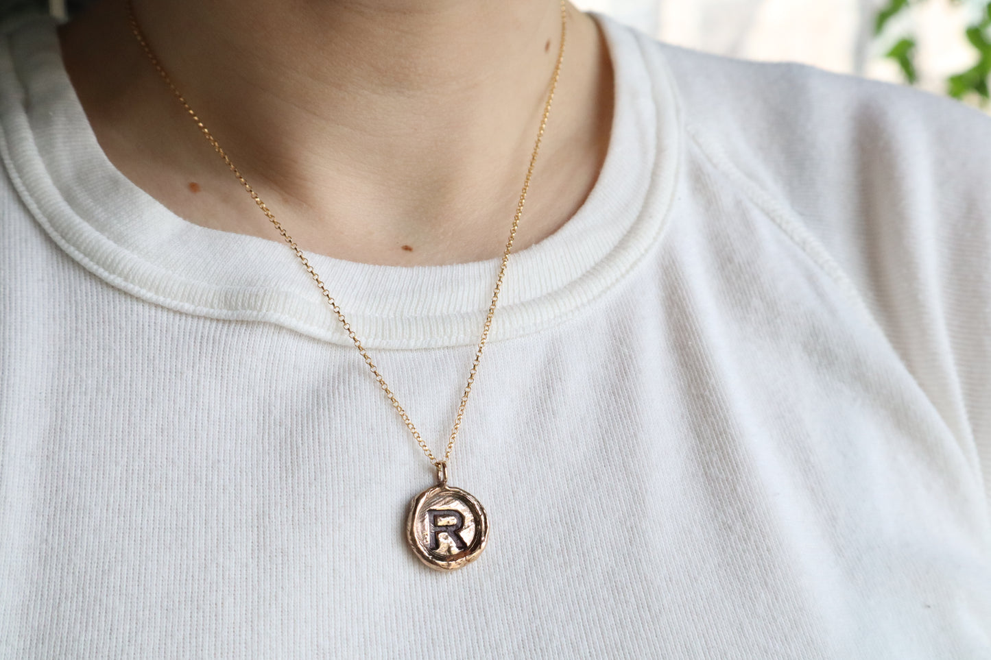 initial pendant in bronze