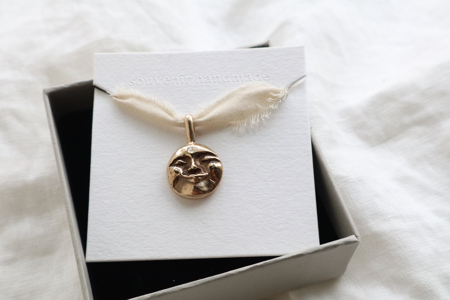 Moon face talisman necklace