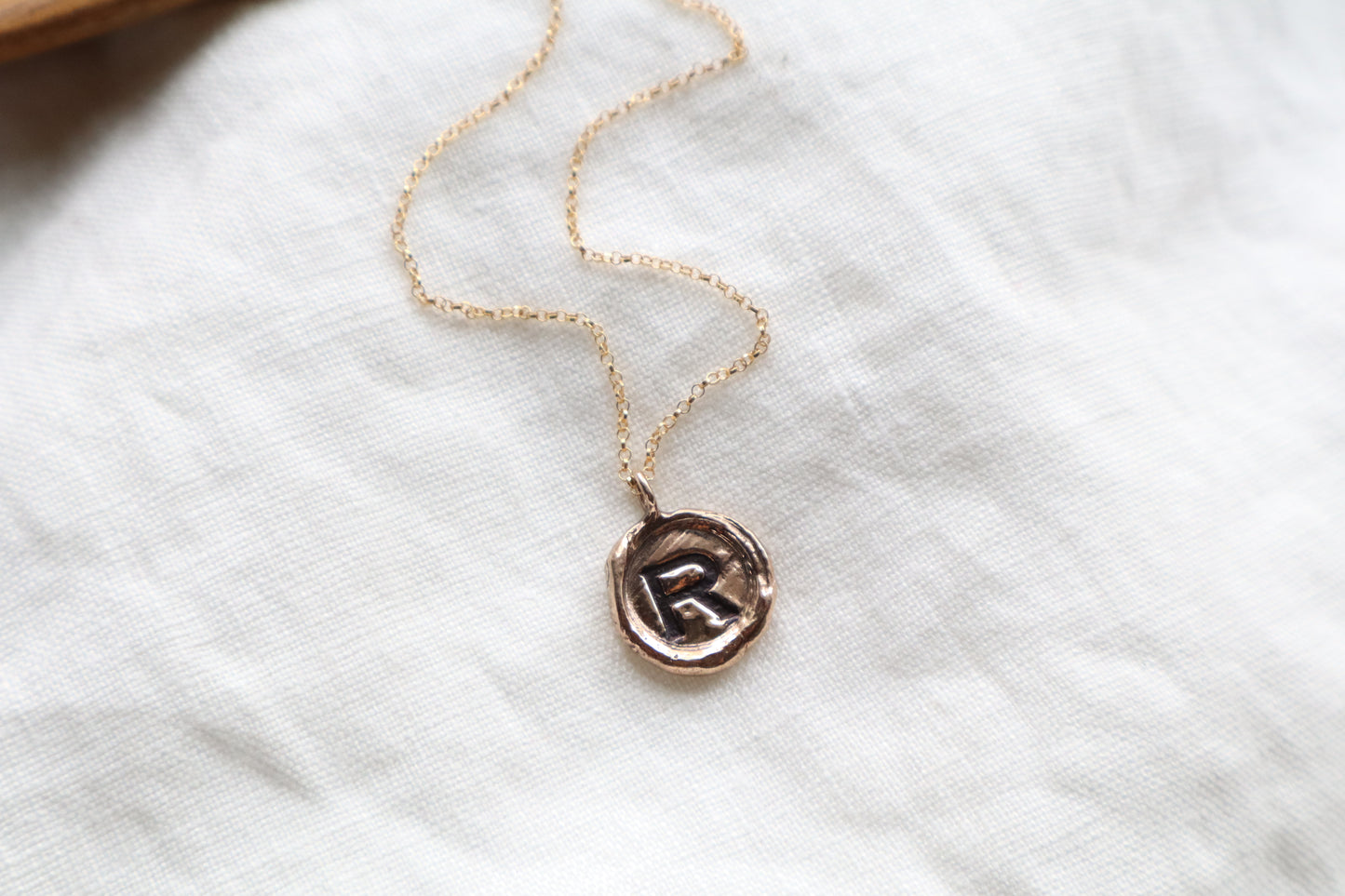initial pendant in bronze